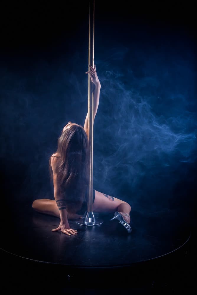 Strip Club Pole with Women Dancing